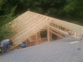 Framing a new roof addition that ties into an existing shingle roof in Elberta